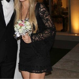 Alexis brand black mini dress ties at top neck size 4